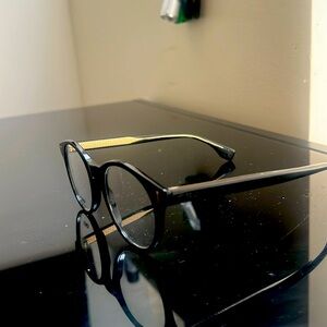 Brand new designer glasses, frame,newer worn but no tags. Too small for my face.